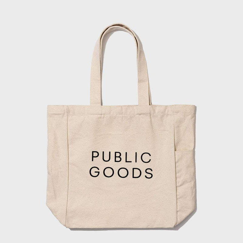 Public Goods Organic Cotton Tote Bag which includes a water bottle holder, zip closure inner pocket, and inner pocket with magnetic clasp.