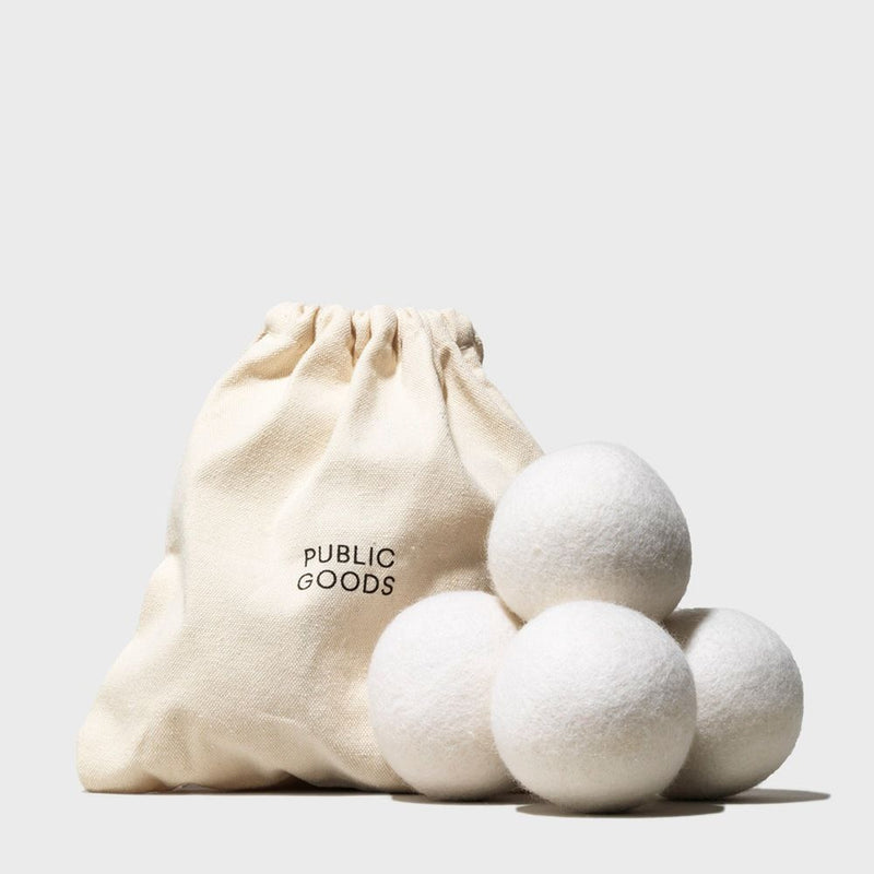 Four wool dryer balls and a bag